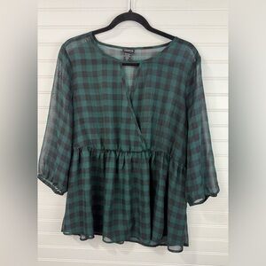 Torrid women’s black & green buffalo print sheer, peplum style blouse. Size 0